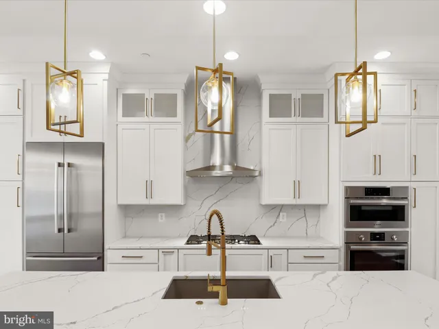 a view of a room with wooden floor and white walls