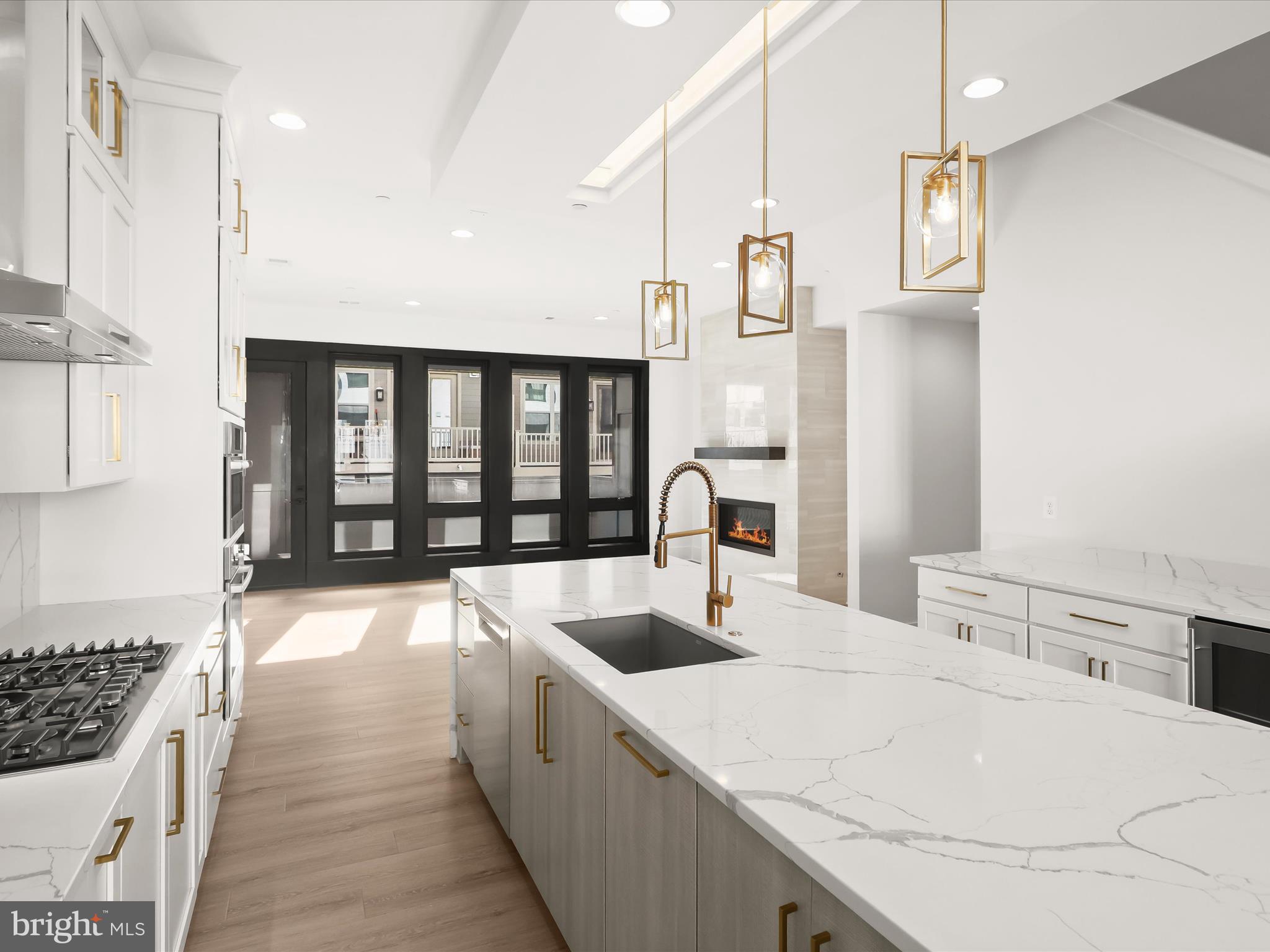 14920 Dispatch Street Rockville, MD 20850 - Photo 23 of 85 a large white kitchen with a large window