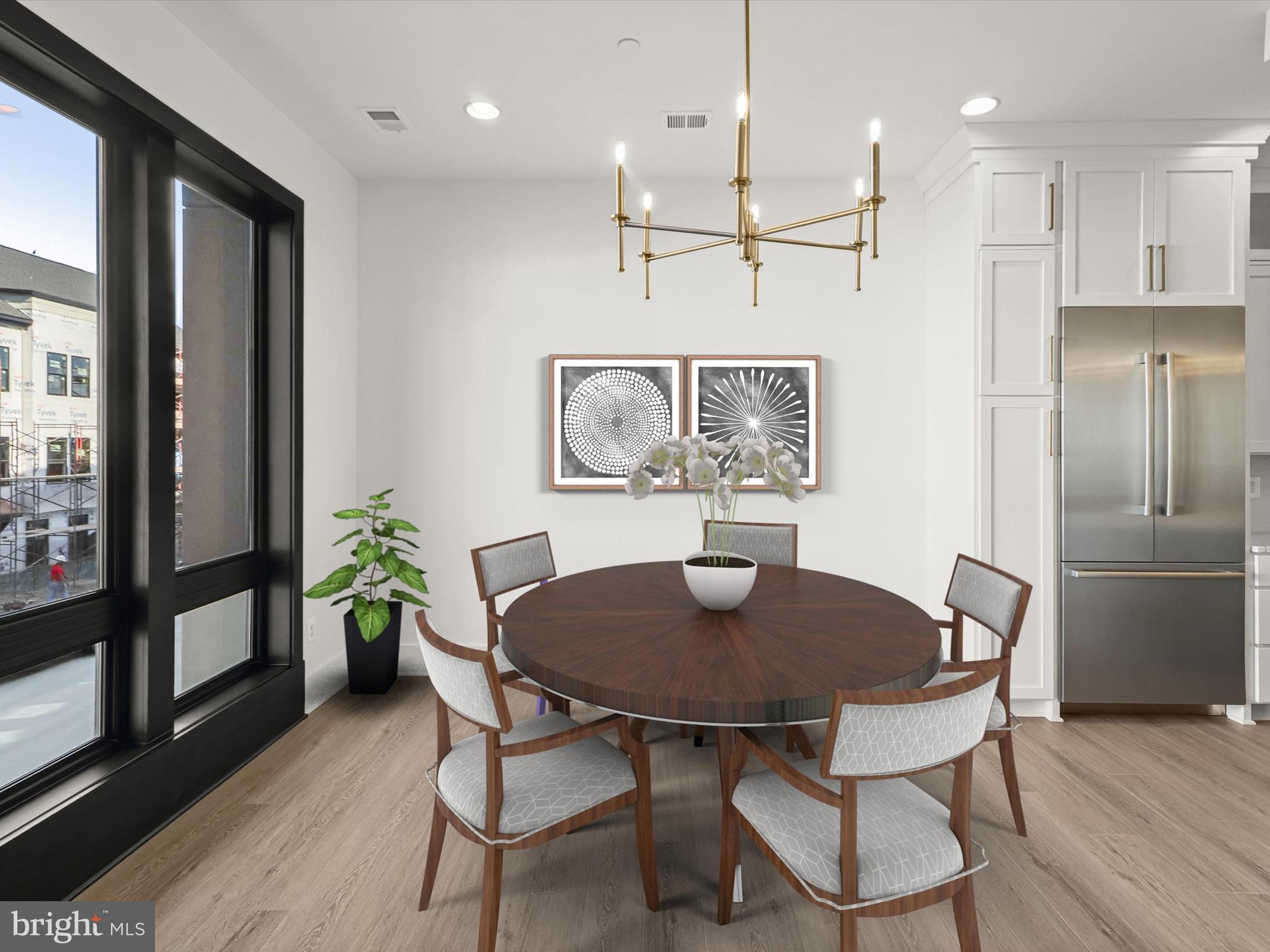 14920 Dispatch Street Rockville, MD 20850 - Photo 27 of 85 a view of a dining room with furniture and wooden floor