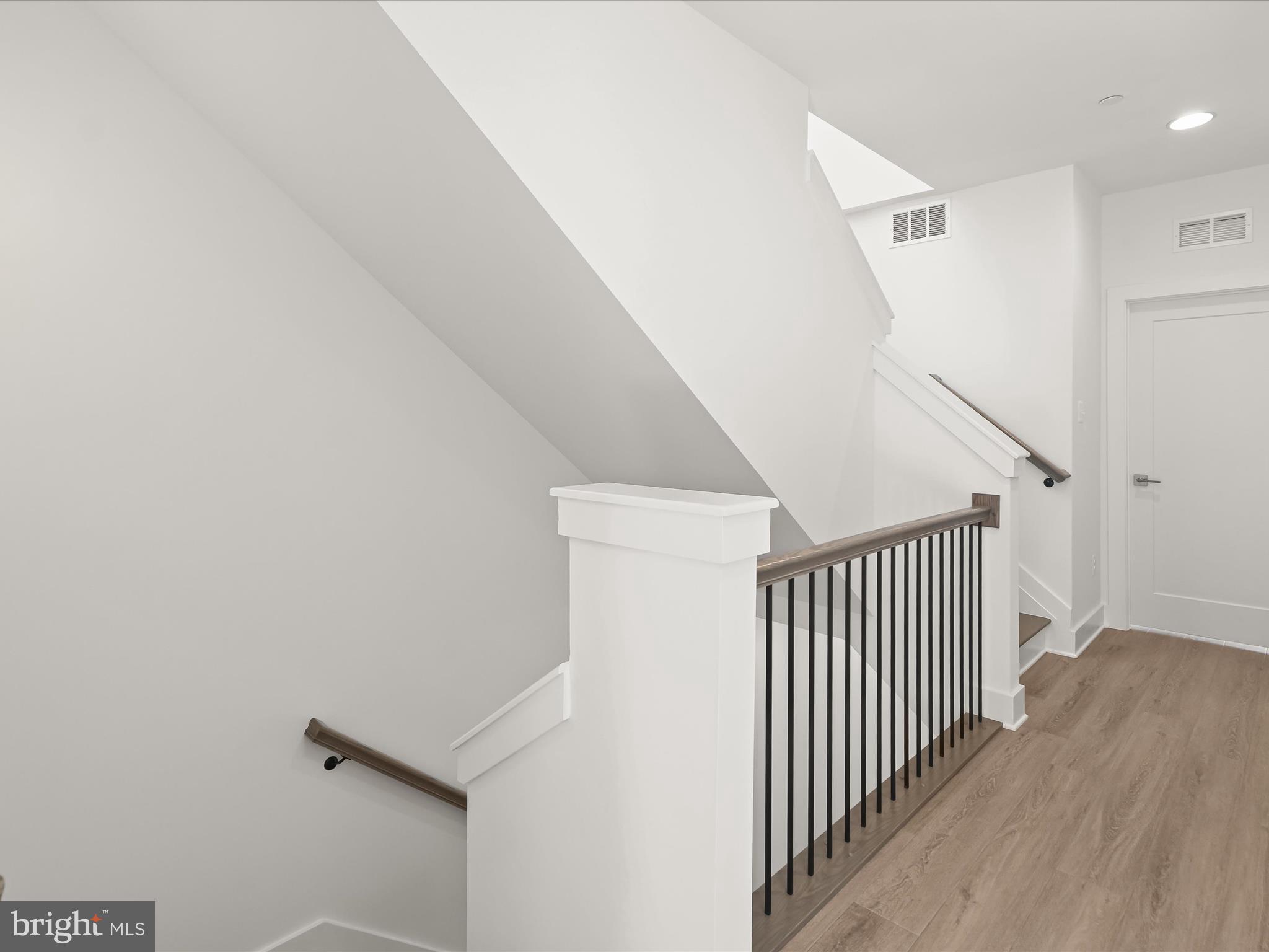 14920 Dispatch Street Rockville, MD 20850 - Photo 32 of 85 a view of a hallway with stairs