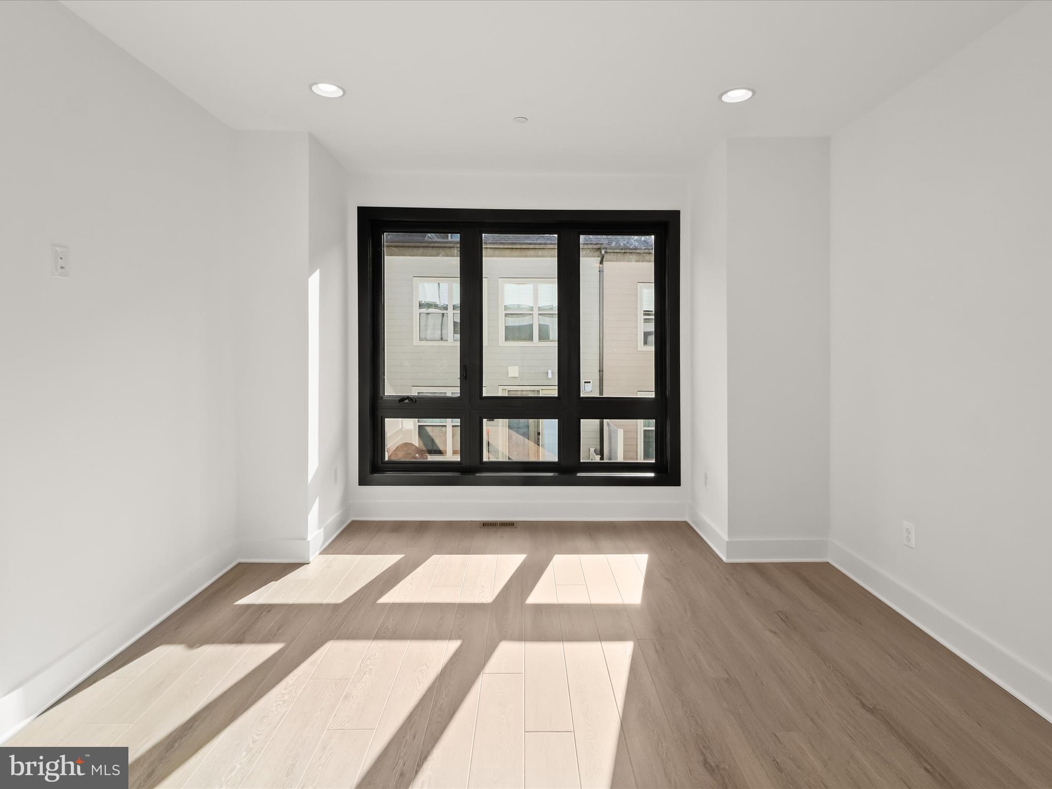 14920 Dispatch Street Rockville, MD 20850 - Photo 35 of 85 wooden floor in an empty room with a window