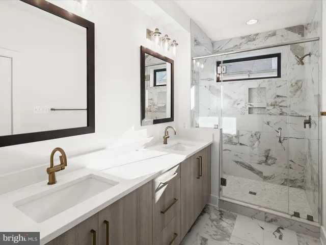 a living room with furniture and flowers