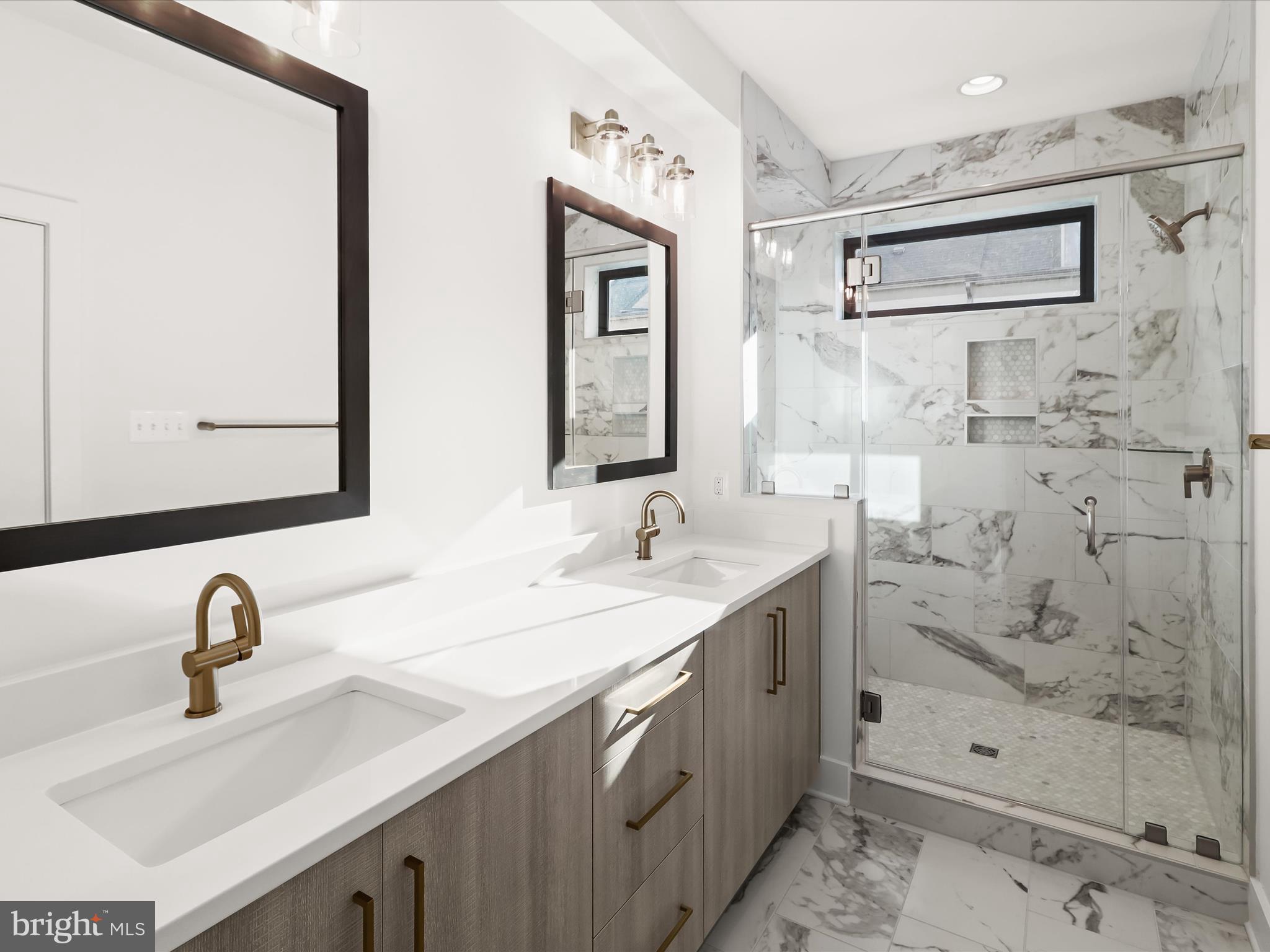 14920 Dispatch Street Rockville, MD 20850 - Photo 42 of 85 a bathroom with a sink double vanity and shower