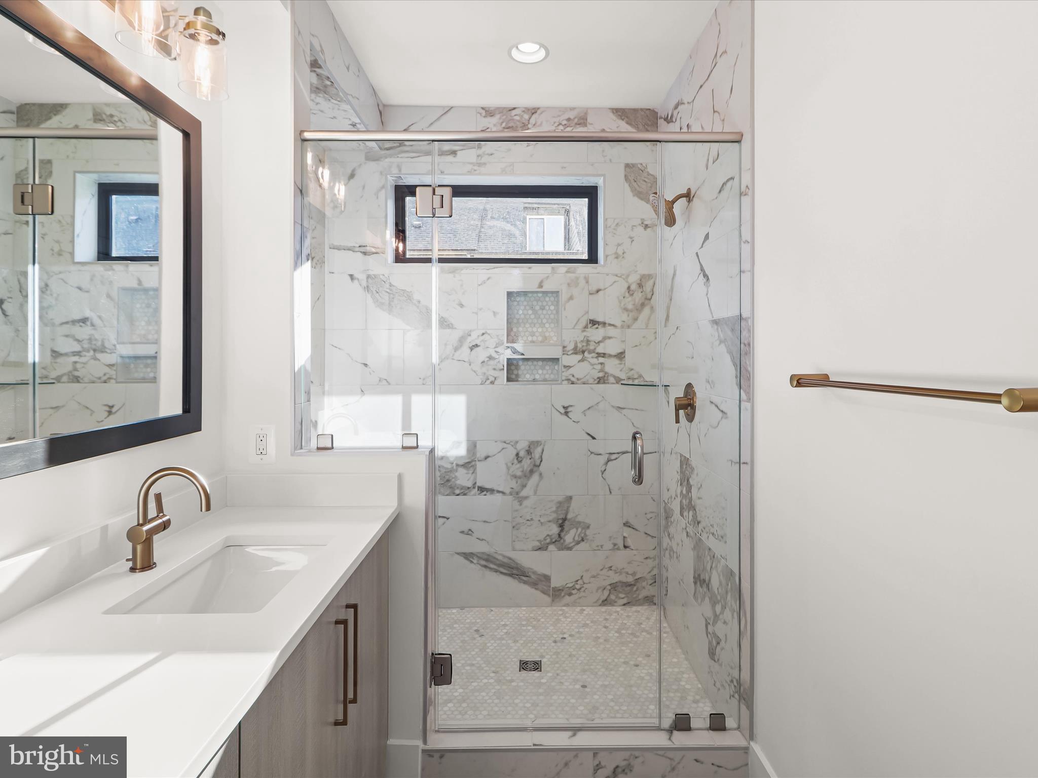 14920 Dispatch Street Rockville, MD 20850 - Photo 43 of 85 a bathroom with a sink and a mirror