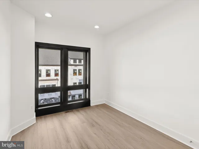 a kitchen with stainless steel appliances granite countertop a refrigerator and a stove