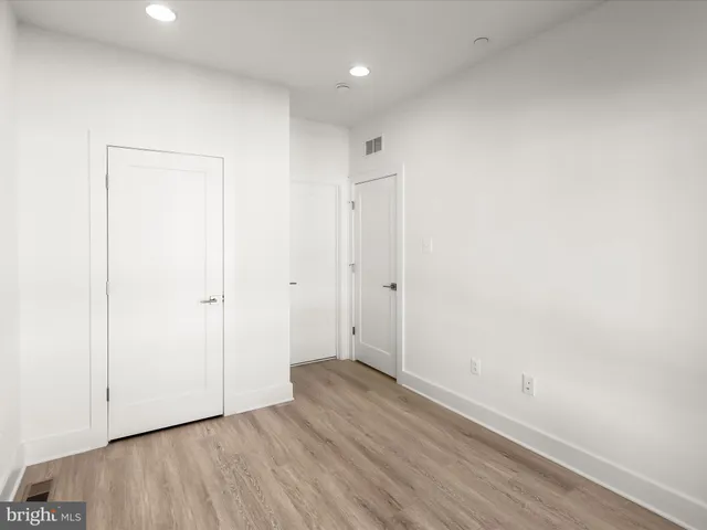 a kitchen with stainless steel appliances granite countertop a sink and a stove
