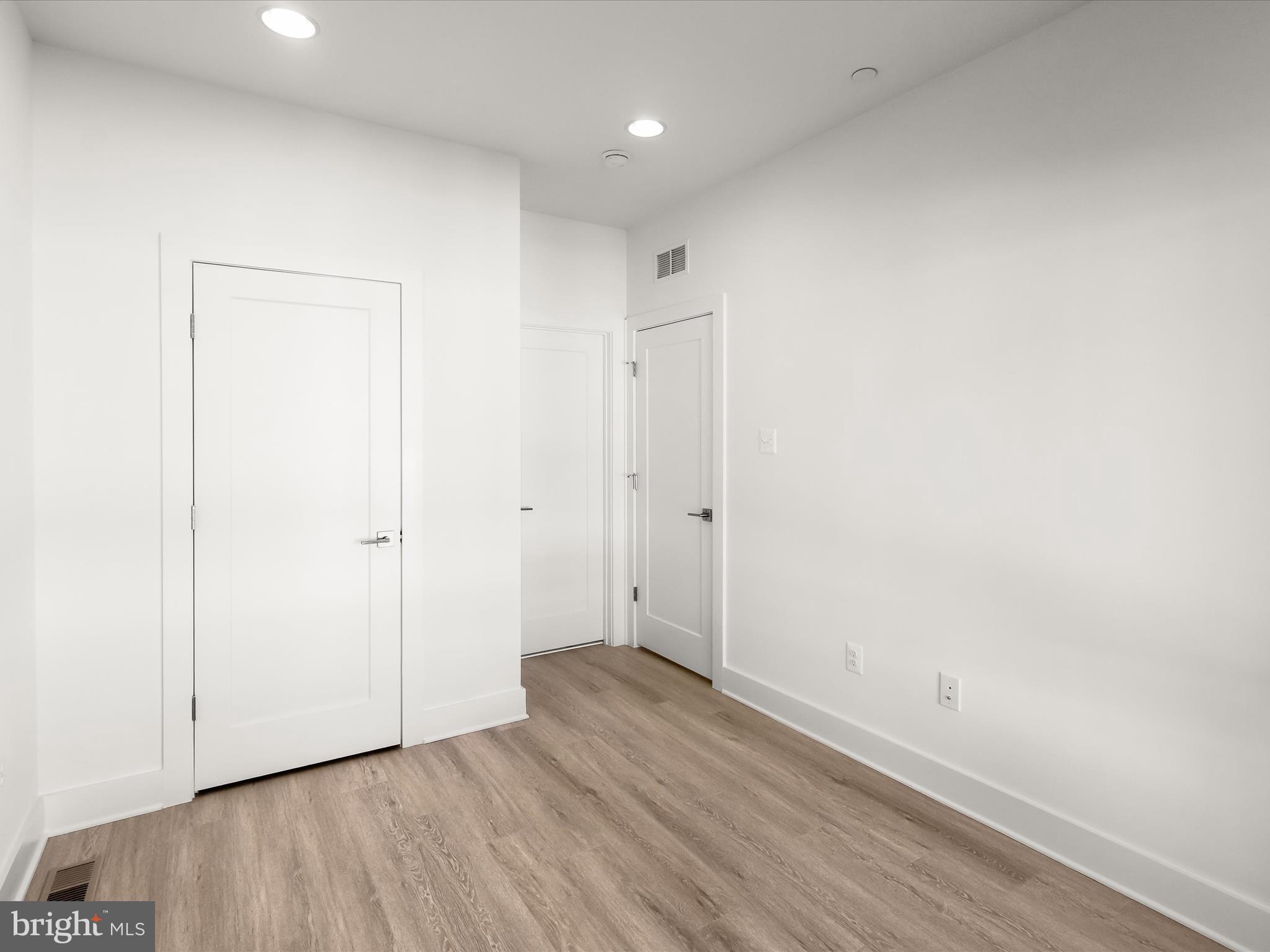 14920 Dispatch Street Rockville, MD 20850 - Photo 46 of 85 a view of an empty room with wooden floor