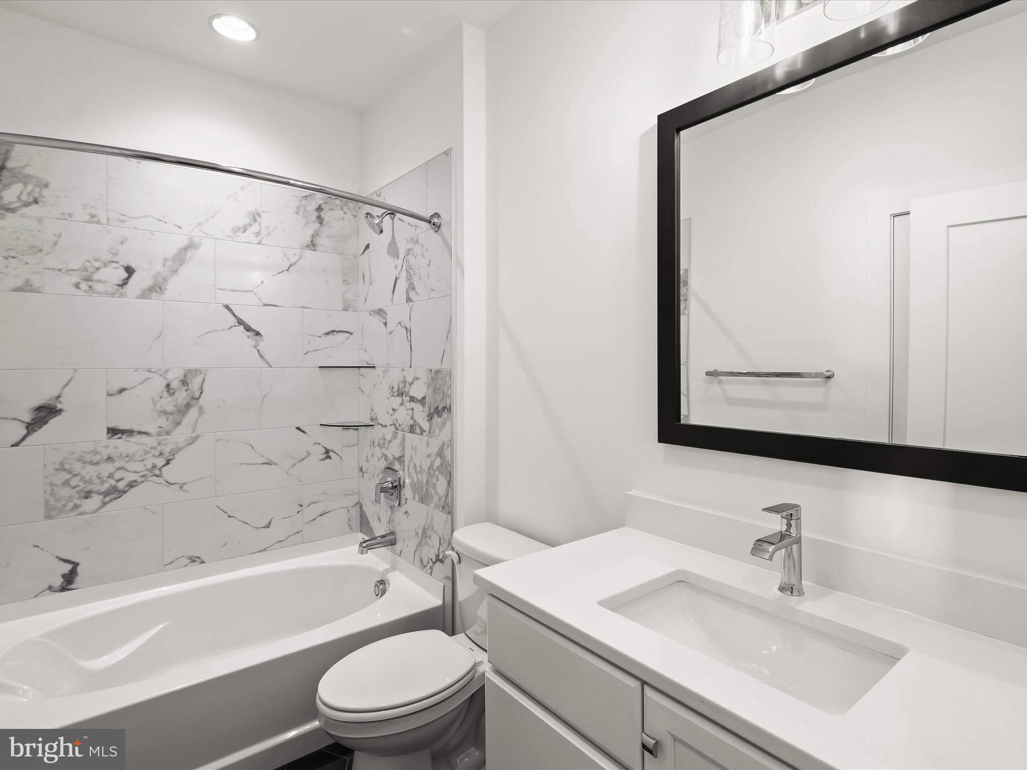 14920 Dispatch Street Rockville, MD 20850 - Photo 47 of 85 a bathroom with a sink a toilet and a bathtub