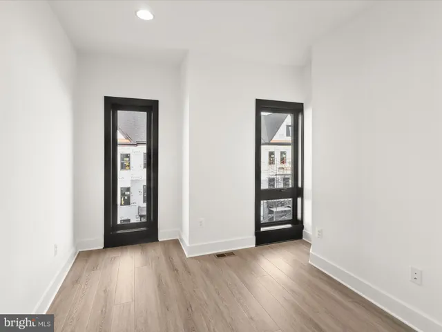 a picture of a bathroom with a shower and a mirror
