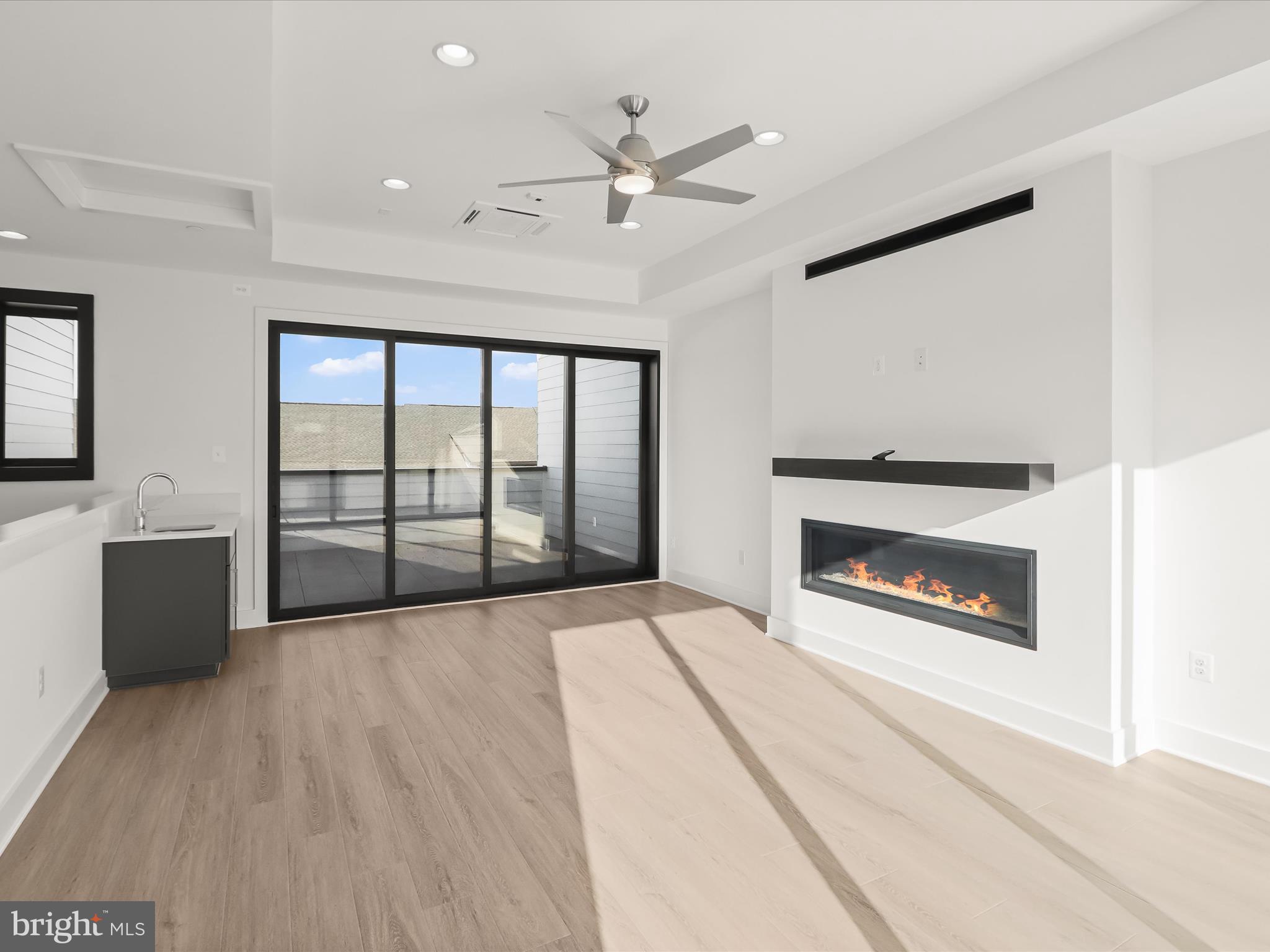 14920 Dispatch Street Rockville, MD 20850 - Photo 62 of 85 a view of an empty room with a fireplace and a window