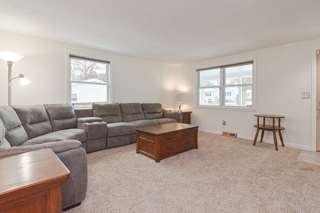 321 Grand Valley Road Springfield, MA 01128 - Photo 3 of 38 a living room with furniture and a window