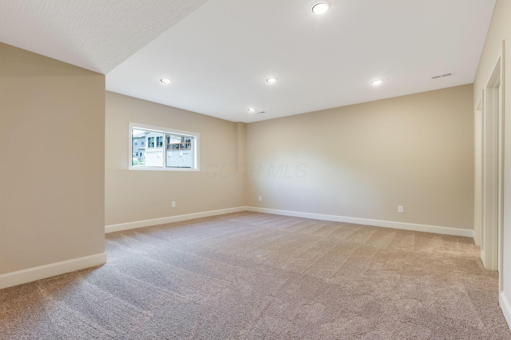 9007 Columbia Road Southwest Pataskala, OH 43062 - Photo 53 of 70 Basement entertainment/flex room with egress