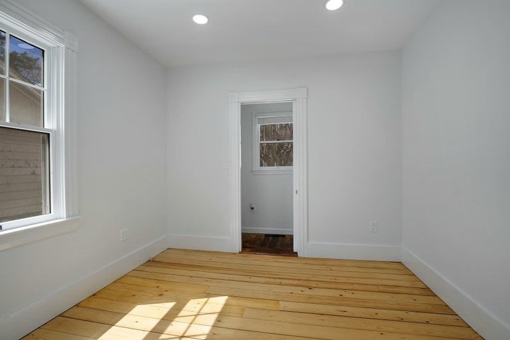 39 Onset Avenue Wareham, MA 02532 - Photo 9 of 30 a view of empty room with wooden floor and fan