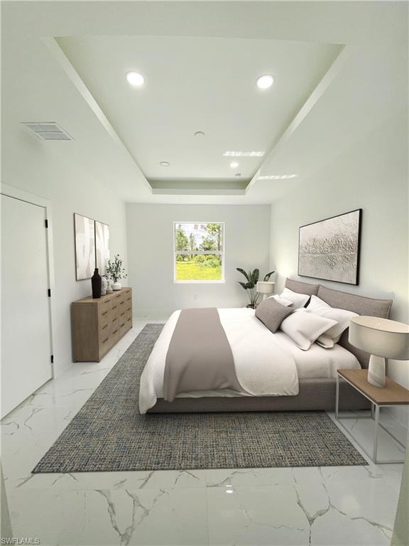 a bedroom with a bed and lamp