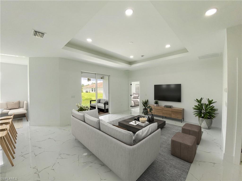 241 Novia Lehigh Acres, FL 33974 - Photo 14 of 28 a living room with furniture and a flat screen tv