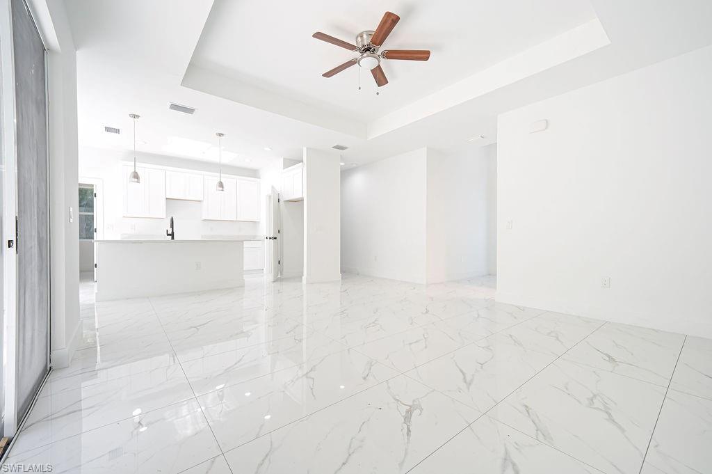 241 Novia Lehigh Acres, FL 33974 - Photo 16 of 28 a view of a kitchen with a refrigerator and a sink