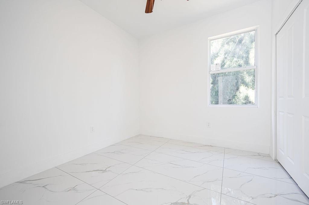 241 Novia Lehigh Acres, FL 33974 - Photo 22 of 28 an empty room with windows