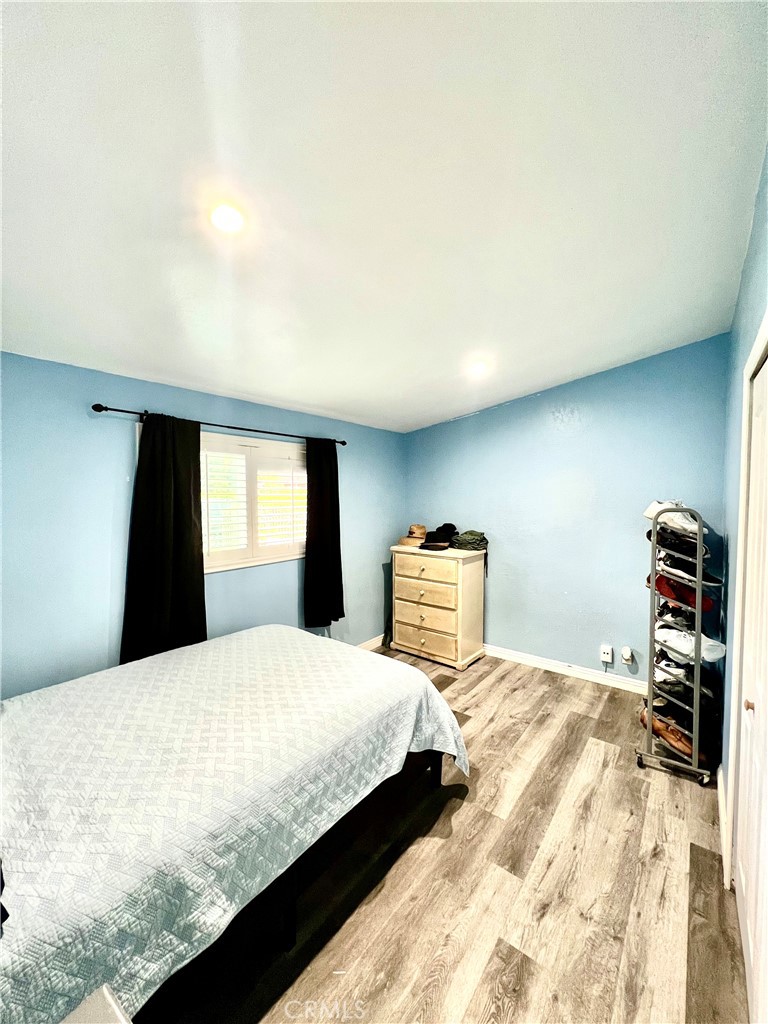 11561 Cherrylee Drive El Monte, CA 91732 - Photo 5 of 8 a bedroom with a bed and a tv