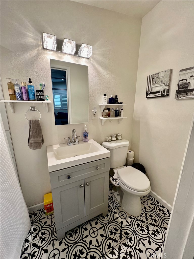 11561 Cherrylee Drive El Monte, CA 91732 - Photo 6 of 8 a bathroom with a sink toilet and mirror