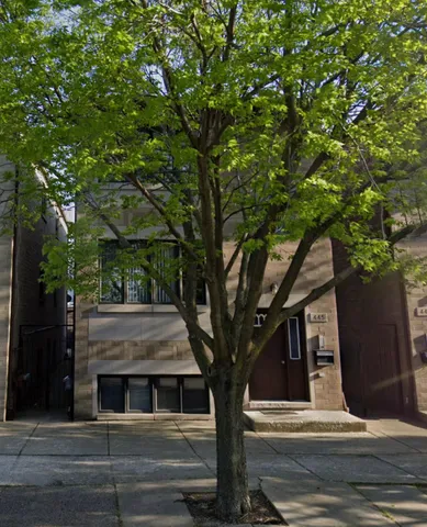 a view of house with a tree