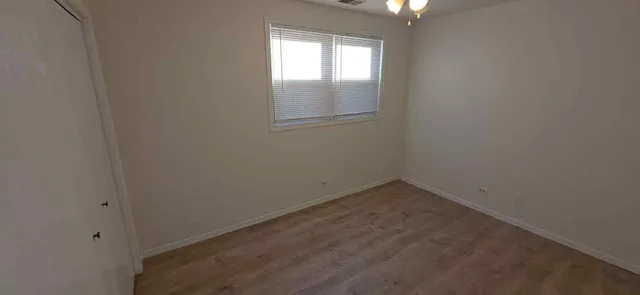 an empty room with a empty space and window