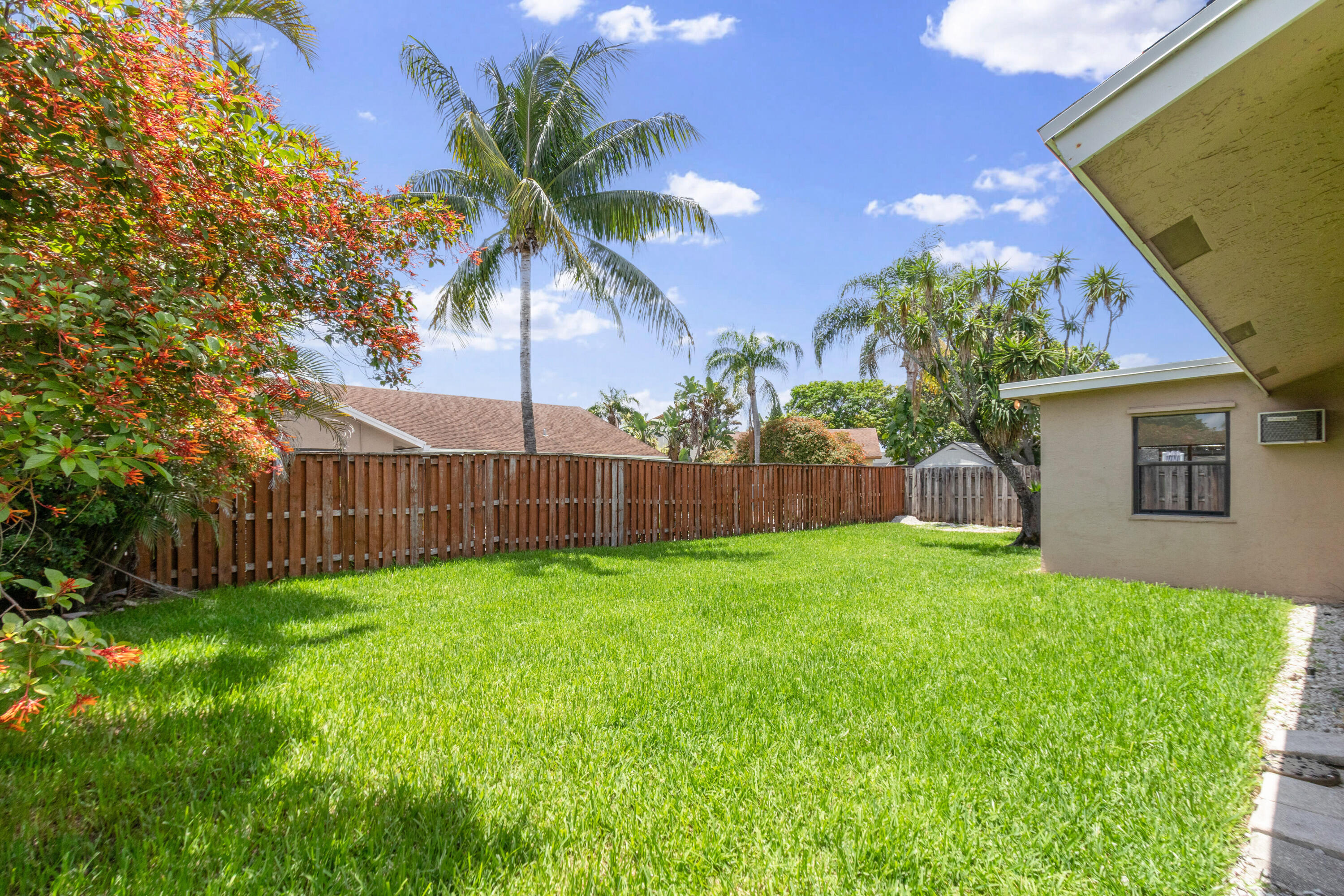 23089 Southwest 55th Avenue Boca Raton, FL 33433 - Photo 22 of 29 a view of a backyard with a garden