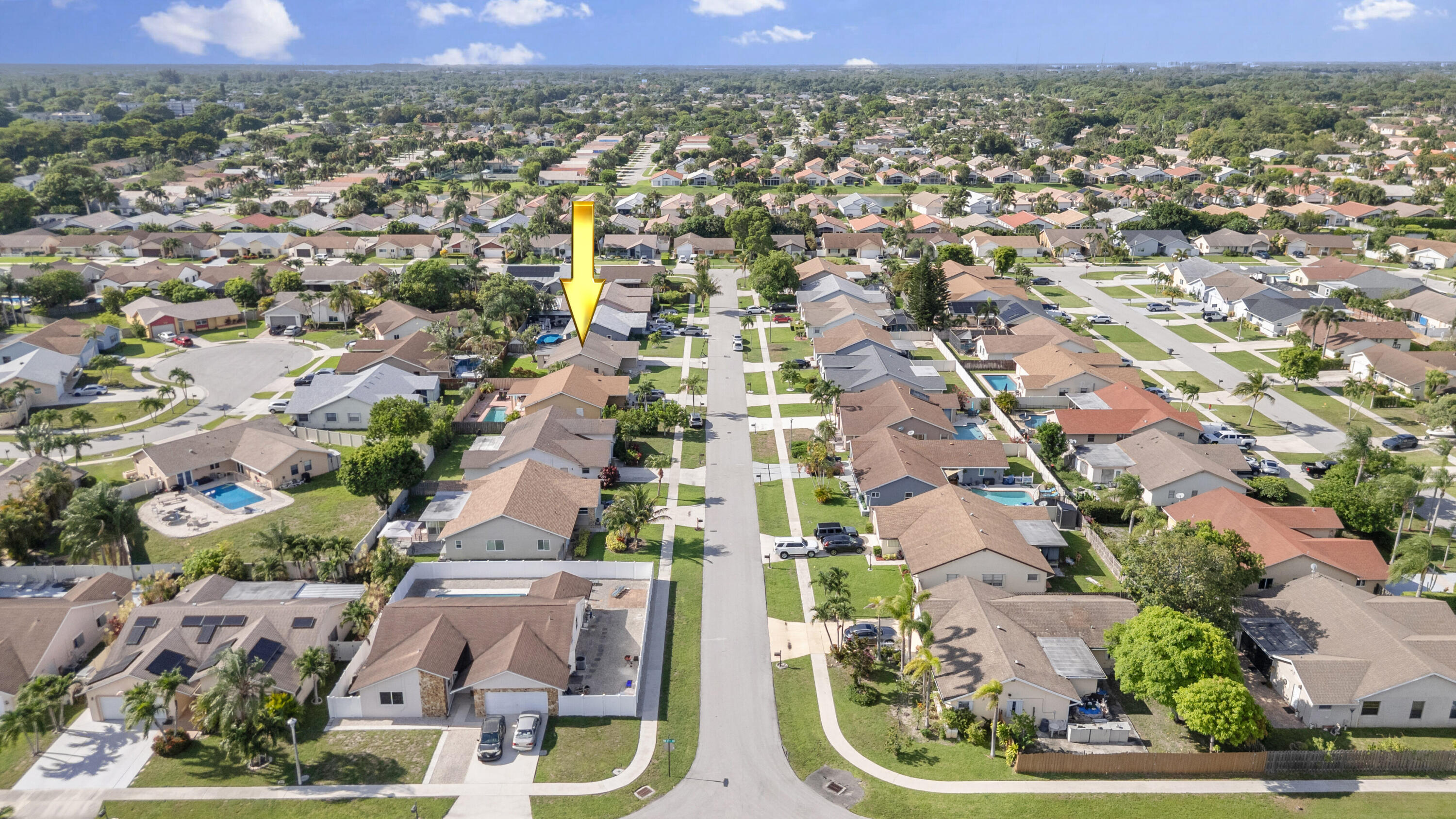 23089 Southwest 55th Avenue Boca Raton, FL 33433 - Photo 28 of 29 an aerial view of residential houses with outdoor space and parking