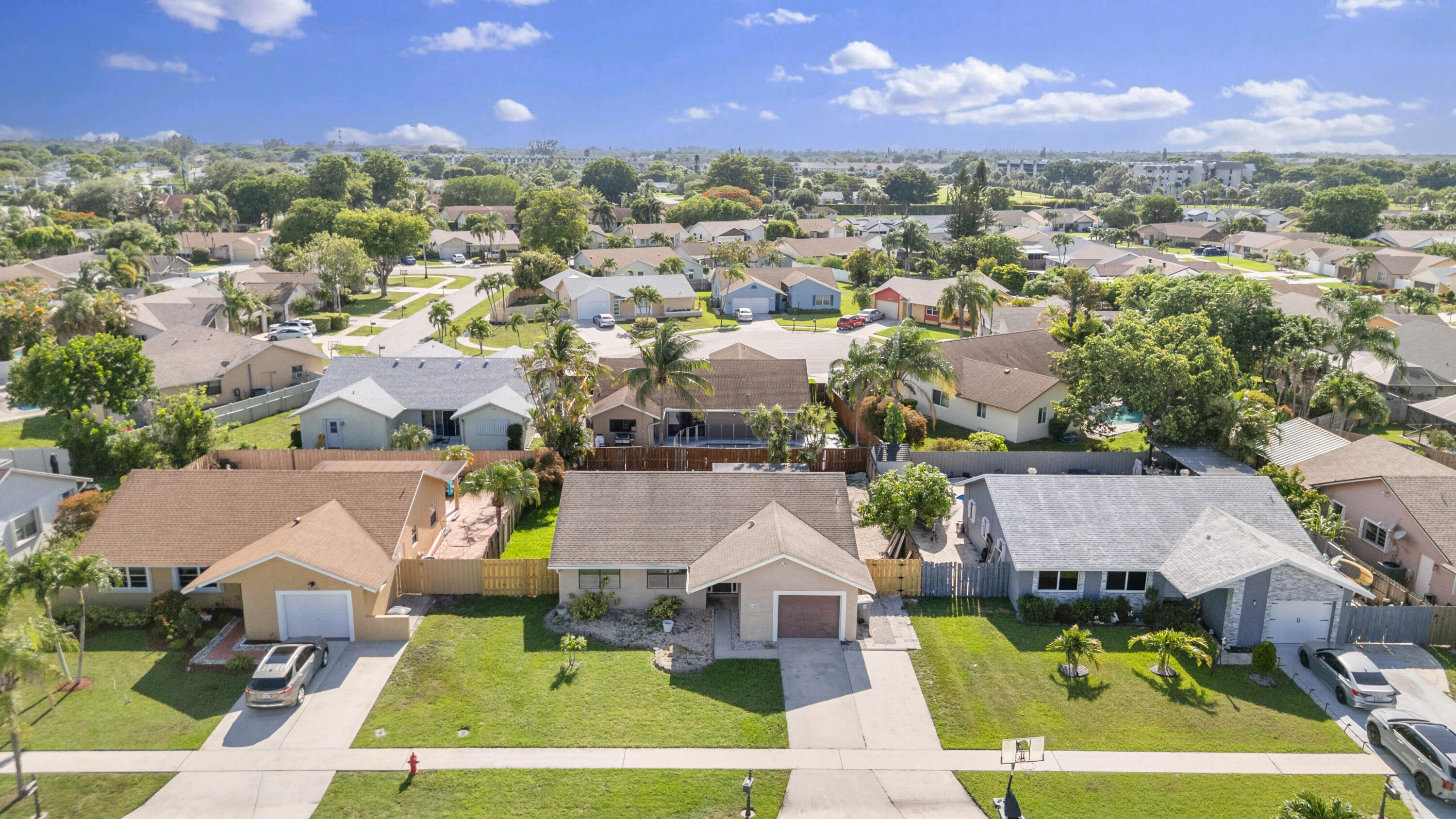 23089 Southwest 55th Avenue Boca Raton, FL 33433 - Photo 3 of 29 an aerial view of a house with a swimming pool outdoor seating and yard