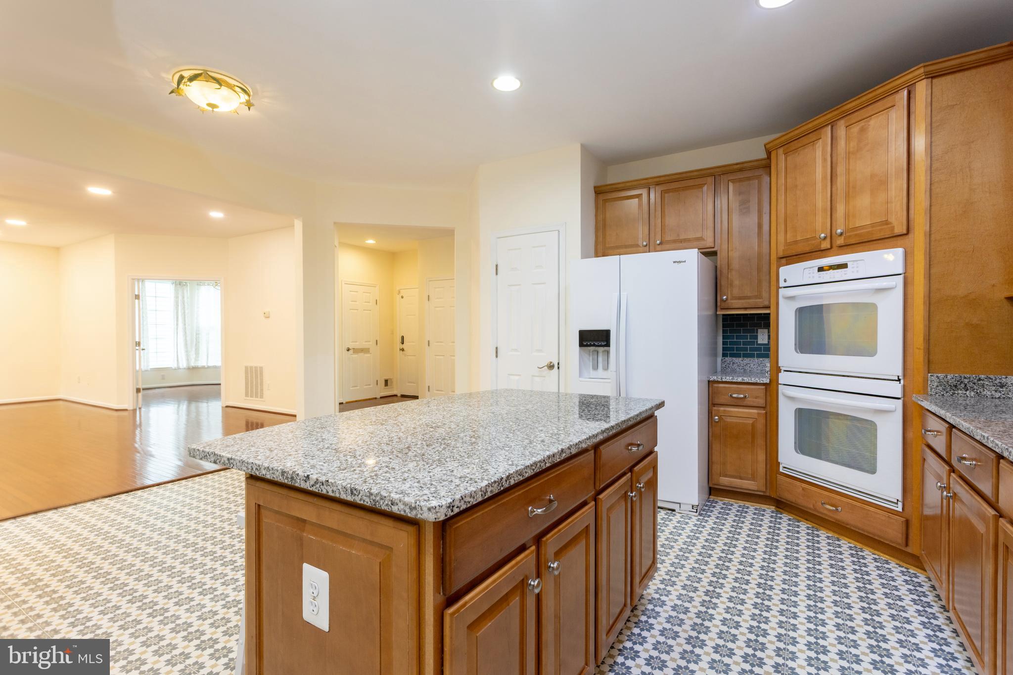2007 Thistlewood Road Baltimore, MD 21209 - Photo 20 of 69 a kitchen with granite countertop kitchen island a sink appliances and cabinets