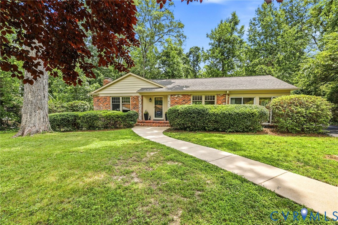 4627 Arrowhead Road Richmond, VA 23235 - Photo 1 of 52 Concrete curved sidewalk leads to covered stoop.