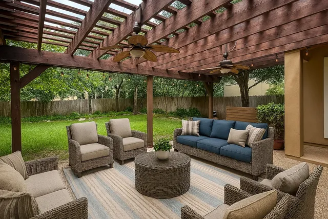 a patio with patio area with furniture and garden view