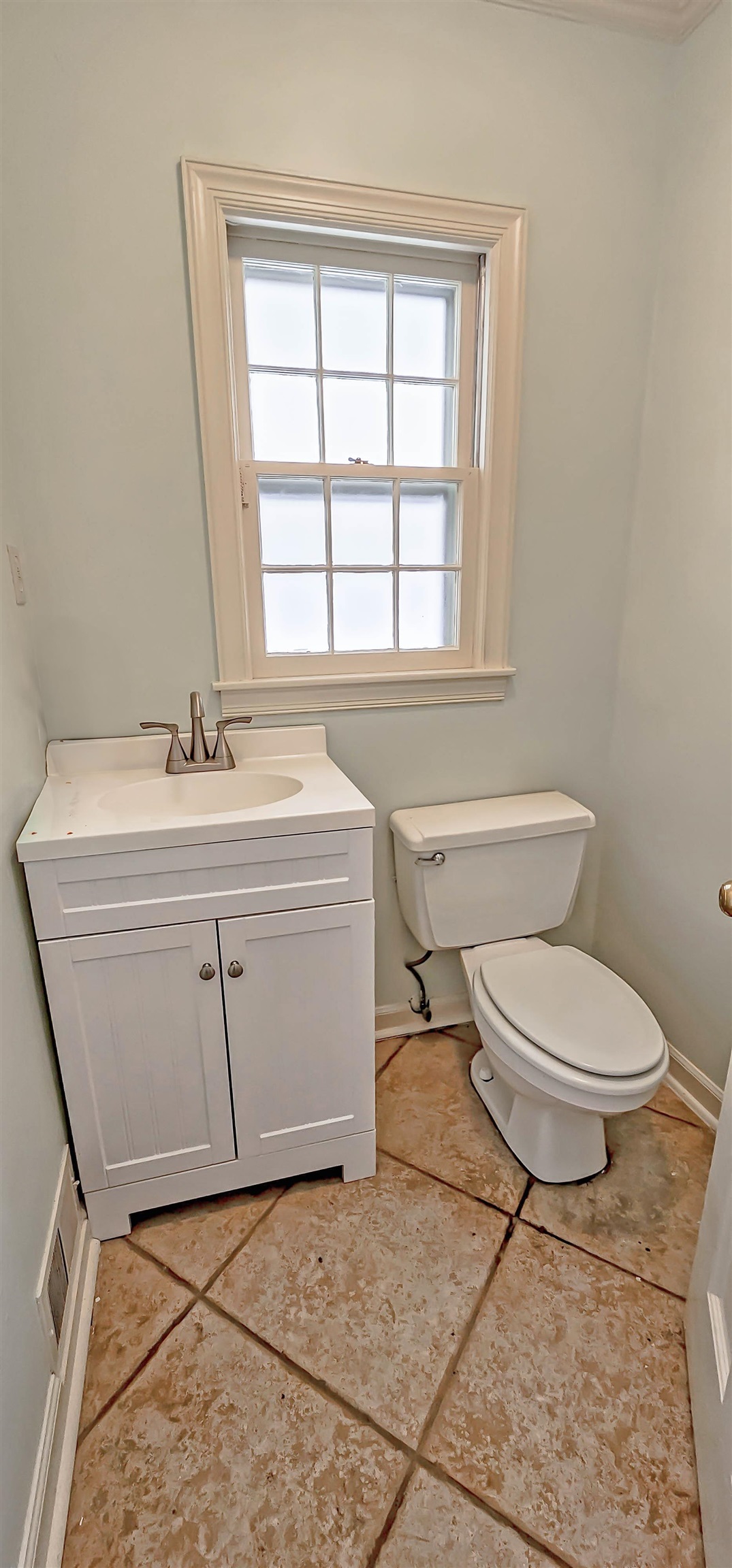 154 Perkins Extension Memphis, TN 38117 - Photo 12 of 40 a bathroom with a sink toilet and window