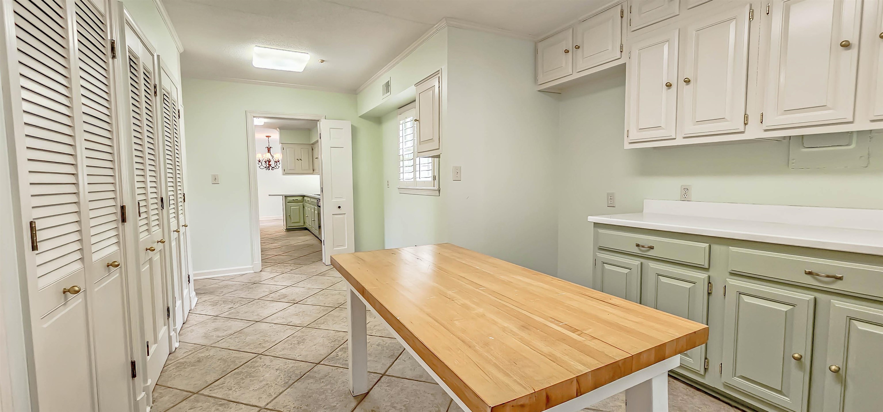 154 Perkins Extension Memphis, TN 38117 - Photo 13 of 40 a kitchen with white cabinets and sink