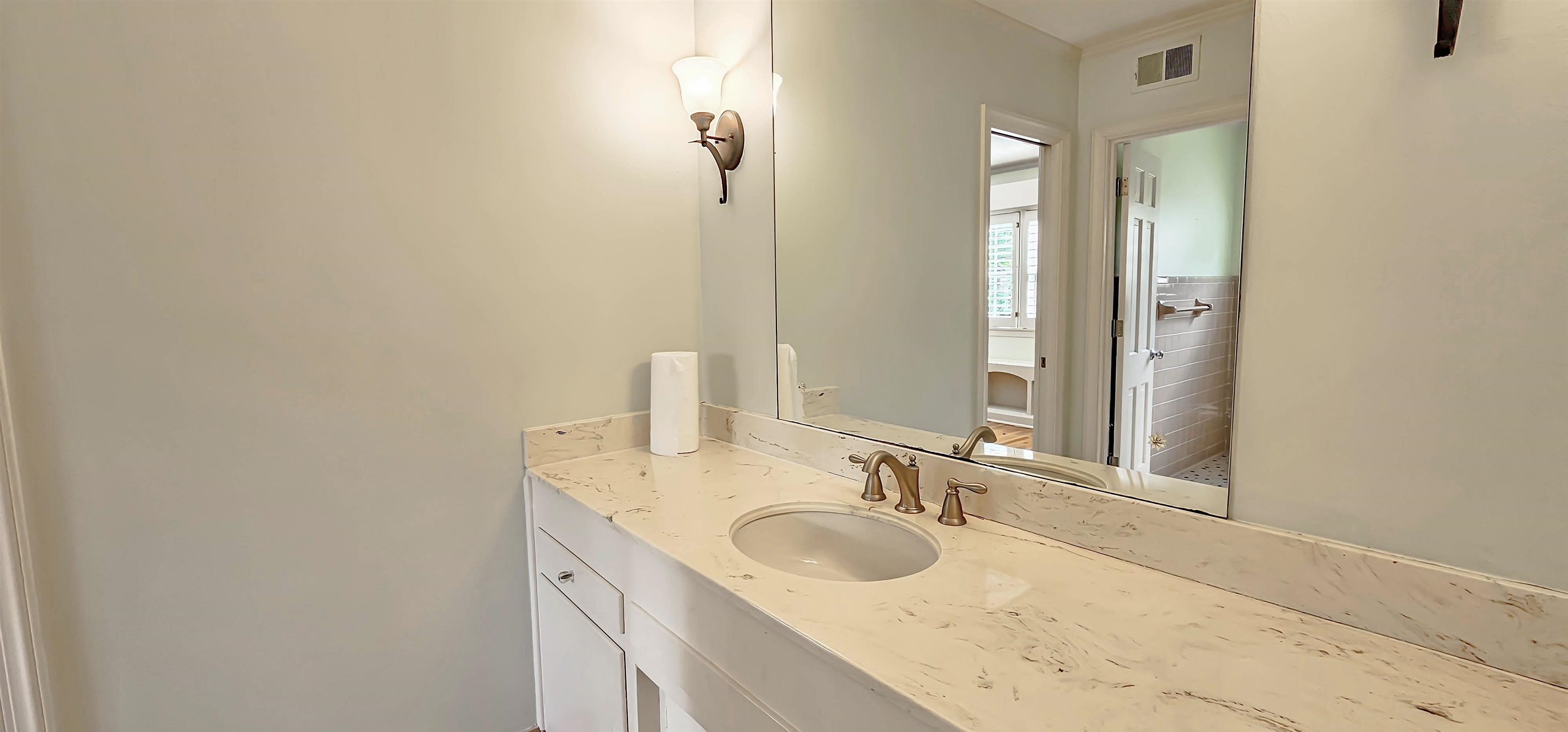 154 Perkins Extension Memphis, TN 38117 - Photo 31 of 40 a bathroom with a sink and a mirror
