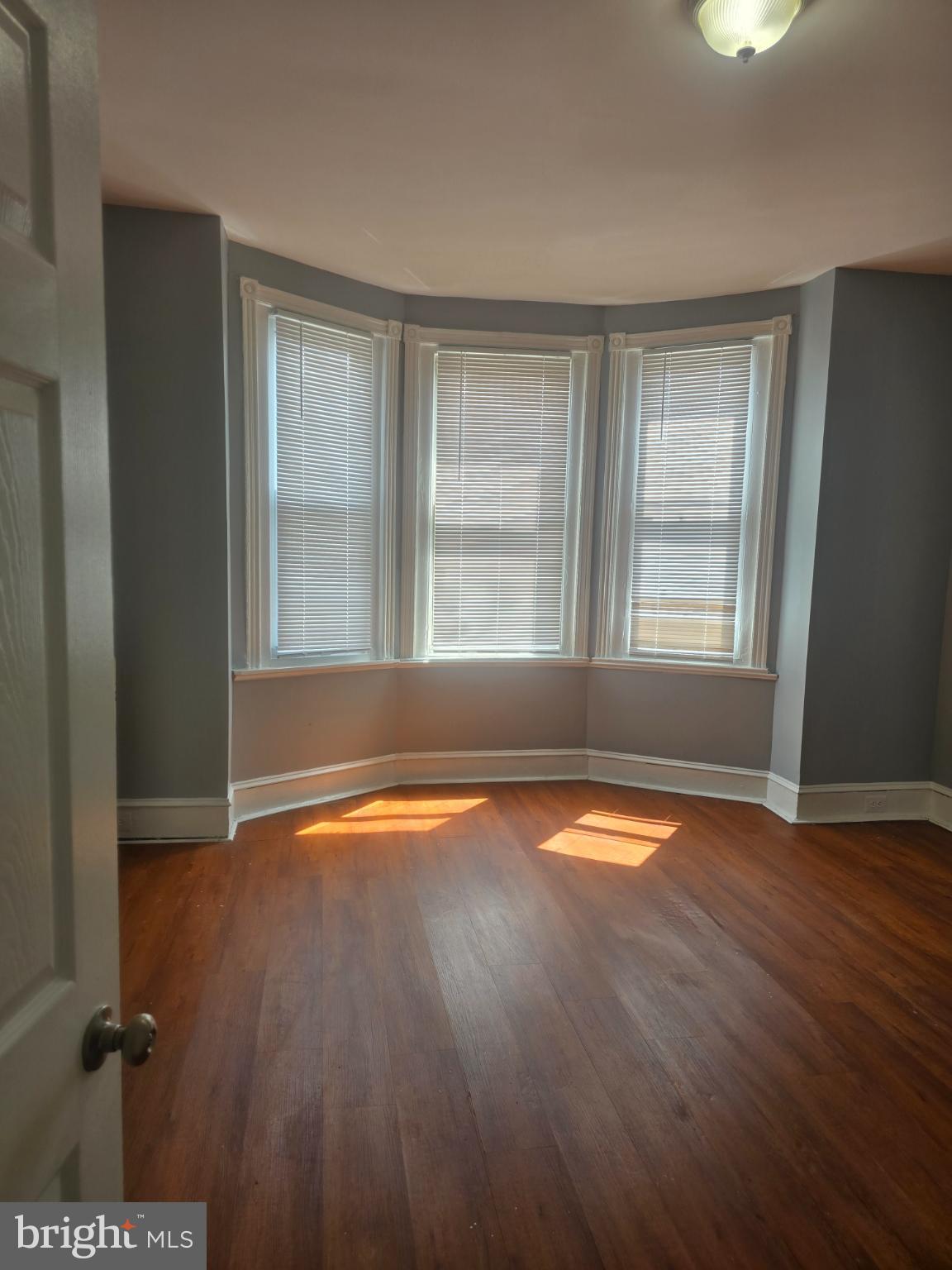 556 North Wanamaker Street Philadelphia, PA 19131 - Photo 11 of 14 Sunlit corner room with elegant bay windows.