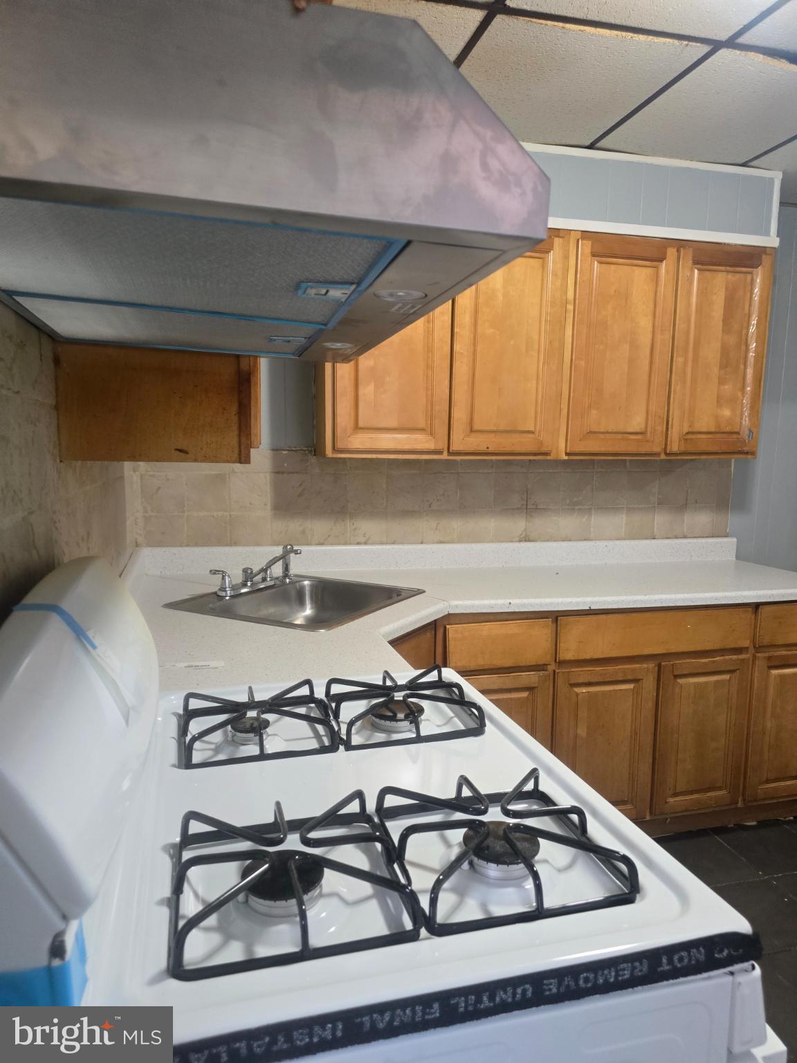 556 North Wanamaker Street Philadelphia, PA 19131 - Photo 5 of 14 Cozy kitchen with modern appliances.