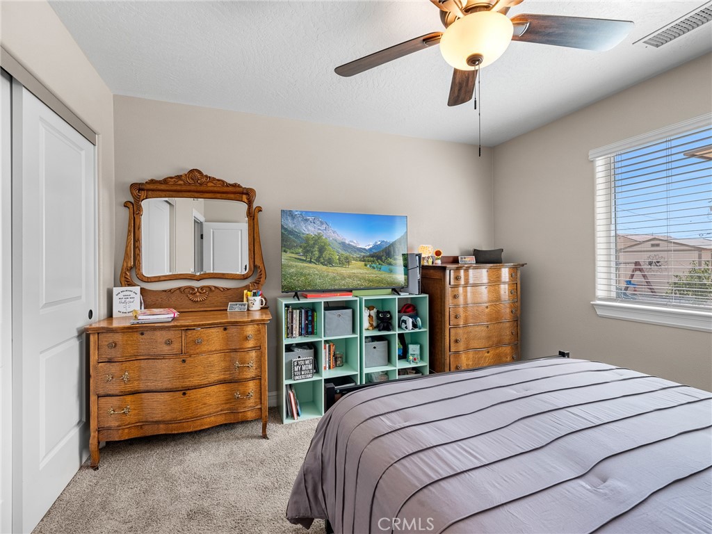 15620 Erie Road Apple Valley, CA 92307 - Photo 20 of 53 a bedroom with a bed and dresser
