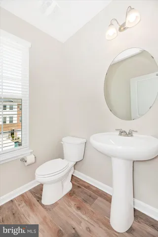 a view of an entryway with wooden floor and stairs