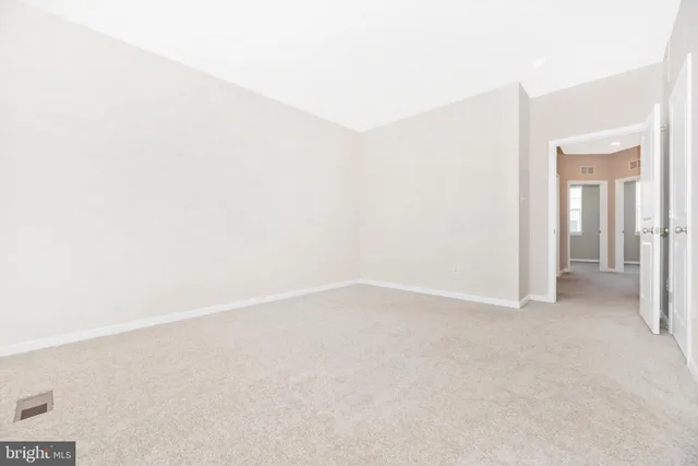 a bathroom with a granite countertop sink and shower