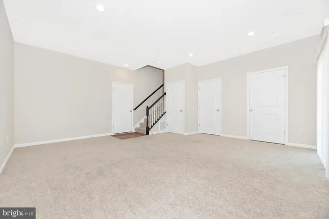 a view of a brick building with large trees