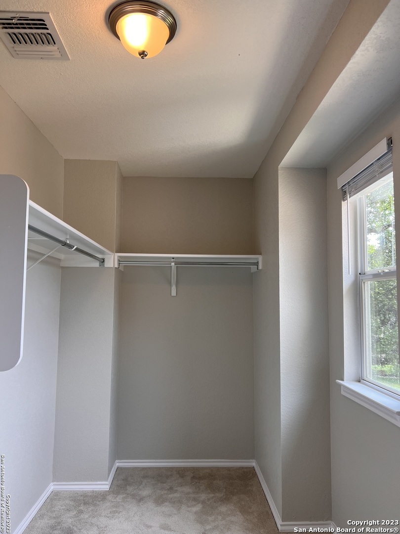 4302 Crystal Bay San Antonio, TX 78259 - Photo 29 of 32 a view of a room with racks on the wall