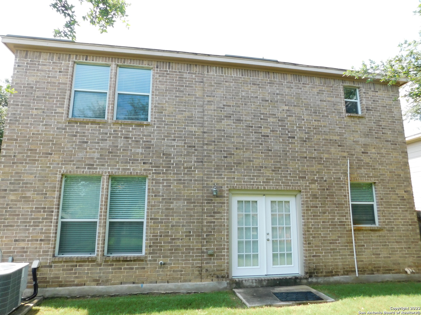 4302 Crystal Bay San Antonio, TX 78259 - Photo 32 of 32 a brick house with a yard