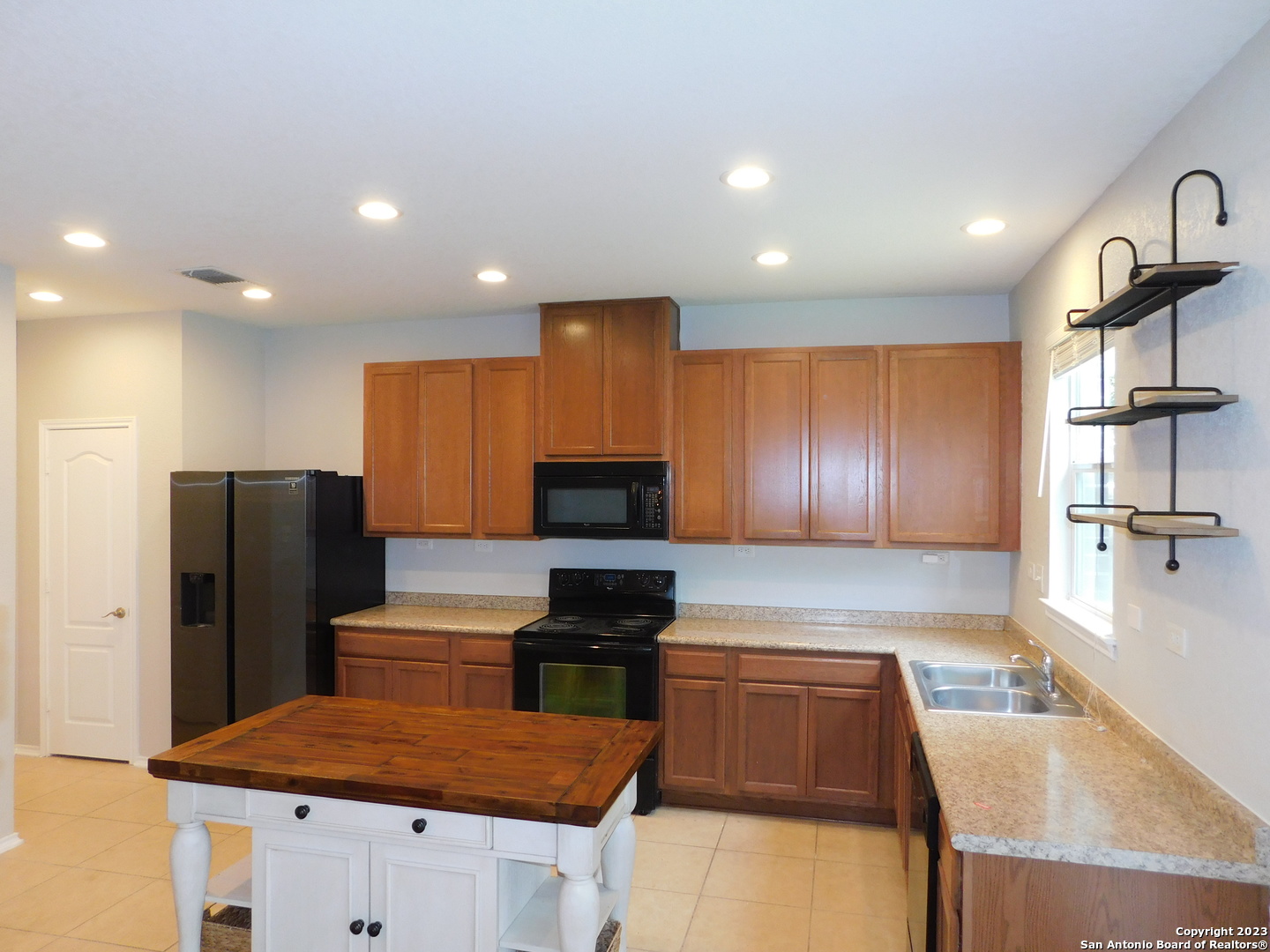 4302 Crystal Bay San Antonio, TX 78259 - Photo 6 of 32 a kitchen with stainless steel appliances granite countertop a refrigerator and a stove