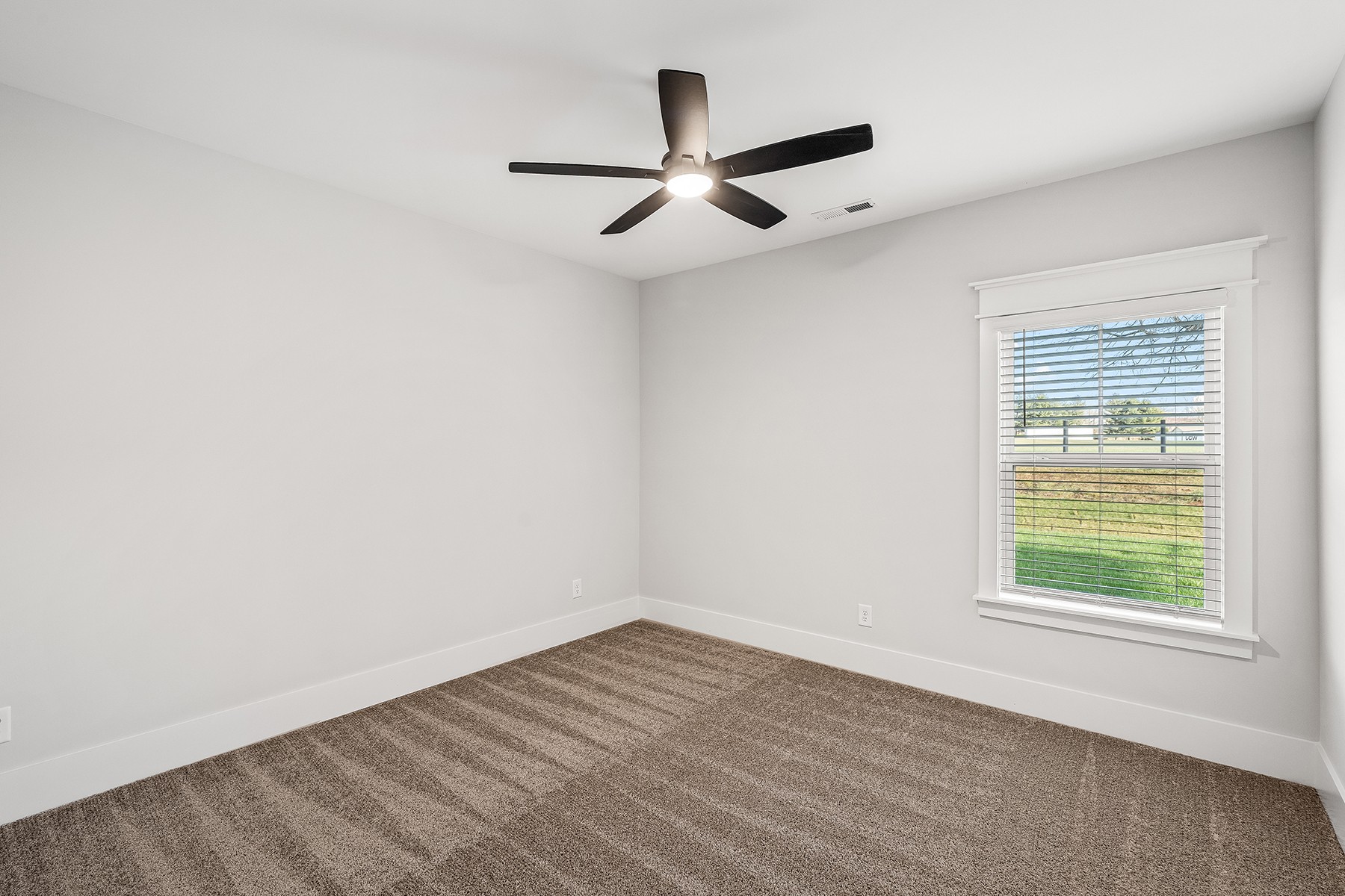 617 Silver Trace White House, TN 37188 - Photo 16 of 19 an empty room with wooden floor ceiling fan and windows
