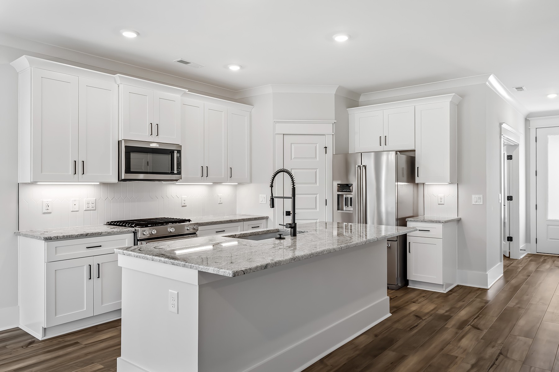 617 Silver Trace White House, TN 37188 - Photo 6 of 19 a kitchen with stainless steel appliances granite countertop a refrigerator and a stove top oven