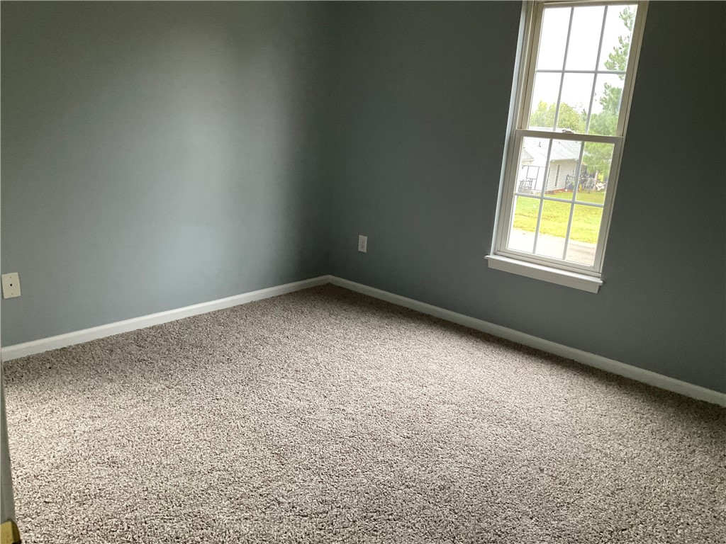 102 Soaring Hawk Court Anderson, SC 29621 - Photo 12 of 15 A single window illuminates this cozy room finished with plush carpeting.