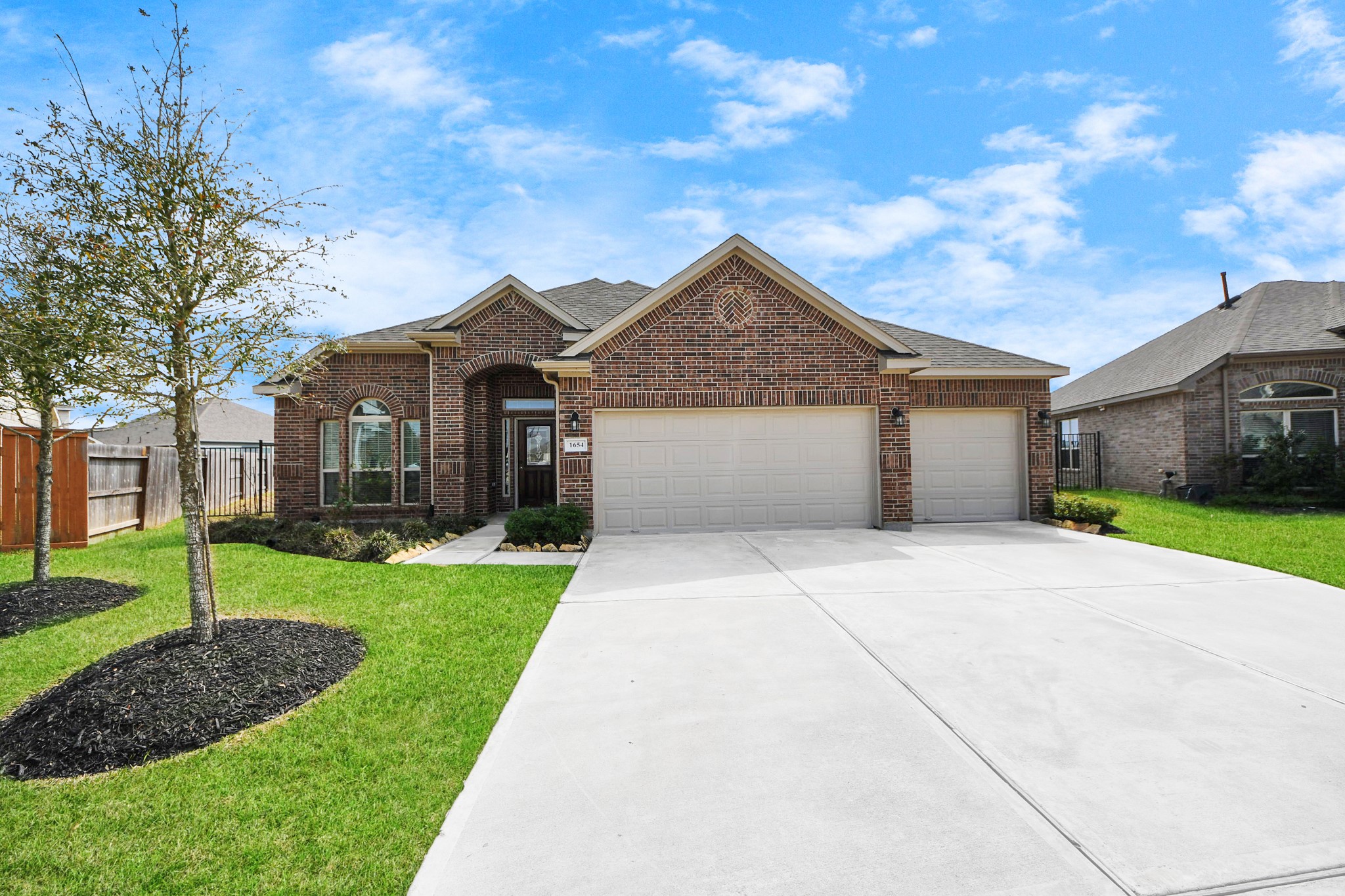 1654 Sequoia Run Drive Rosharon, TX 77583 - Photo 21 of 24 a front view of a house with a yard and garage