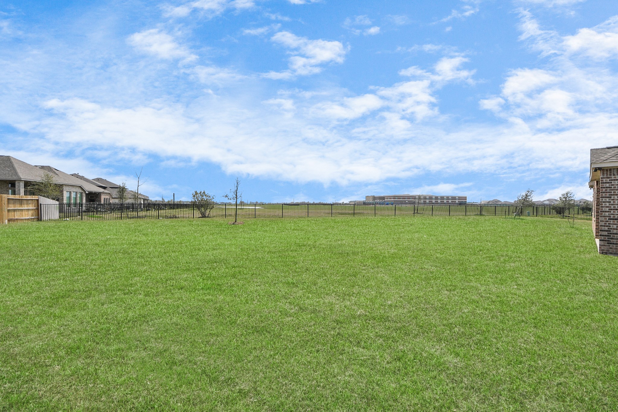 1654 Sequoia Run Drive Rosharon, TX 77583 - Photo 24 of 24 a view of a field with grass and trees in the background