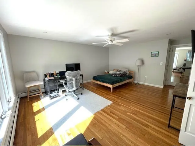 a living room with furniture and flat screen tv