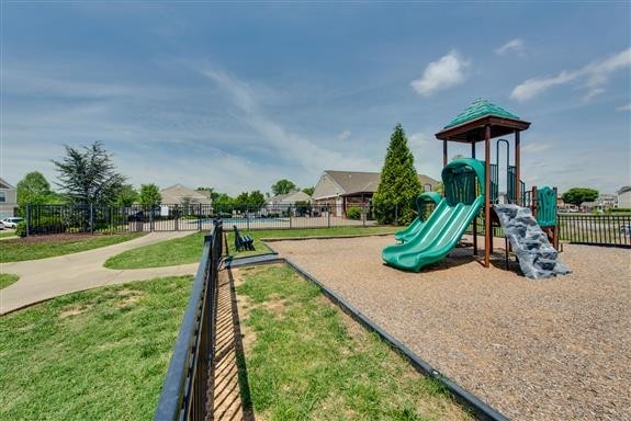 7006 Magnolia Crossings Spring Hill, TN 37174 - Photo 16 of 18 a view of a house with swimming pool and yard